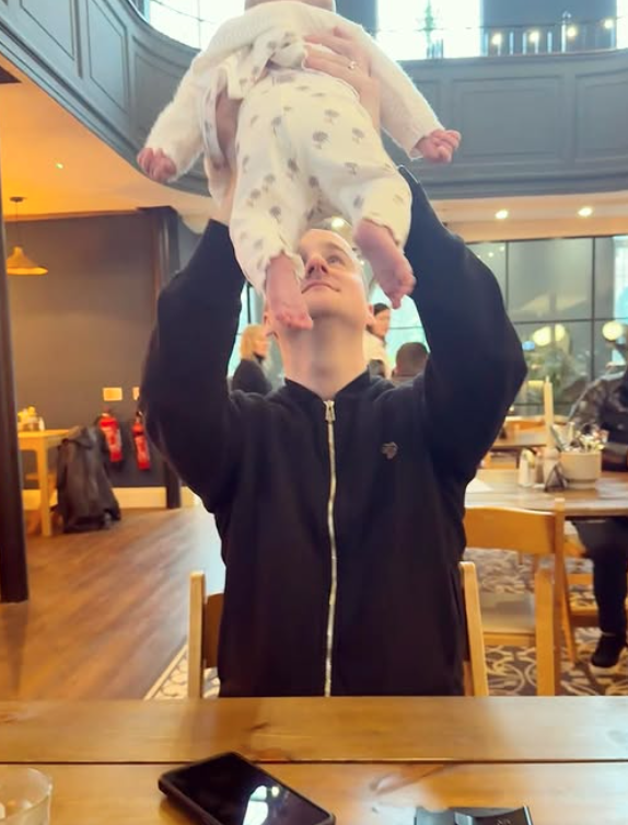 Mike with his baby