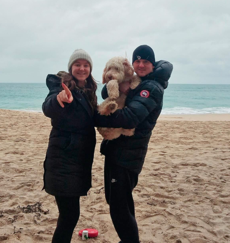 Mike and family on the beach with their dog